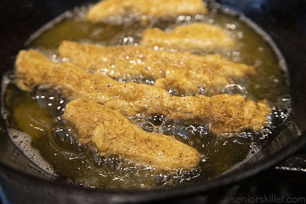 Chicken frying in lard