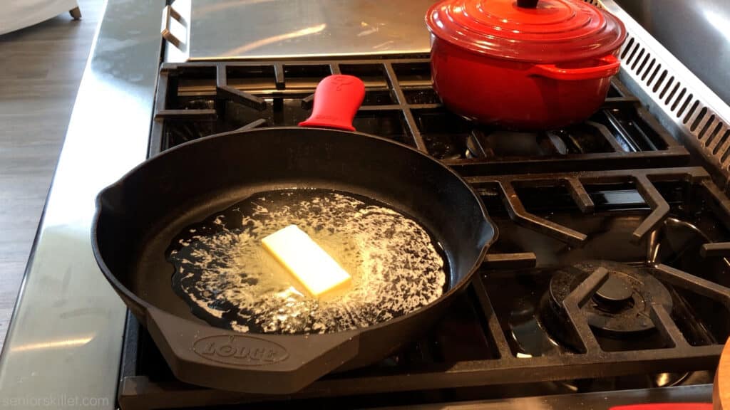 Butter melting in a cast iron skillet