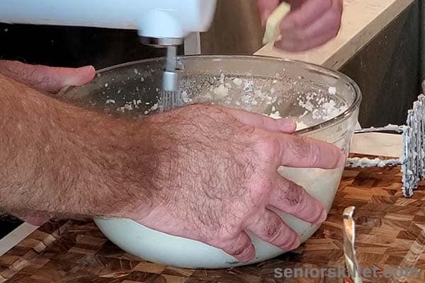 Adding butter to potatoes