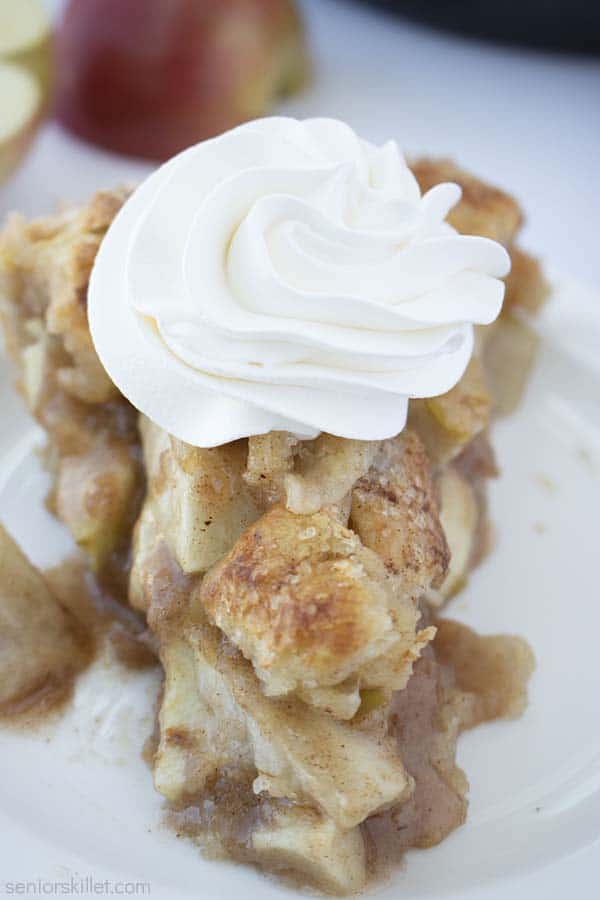 Slice of apple pie with whipped cream