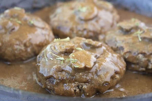 Fully could steaks with gravy in pan