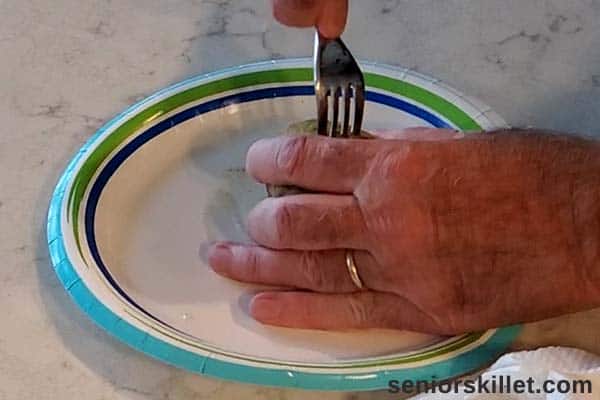 Stabbing fork into the potato