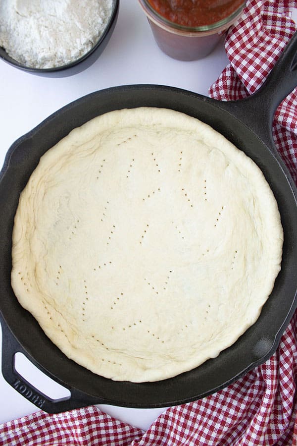 pizza crust in a cast iron skillet