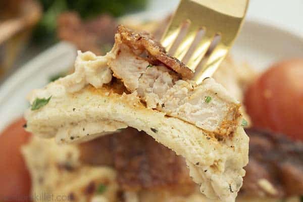 Closeup on a fork of Turkey bacon sadwich