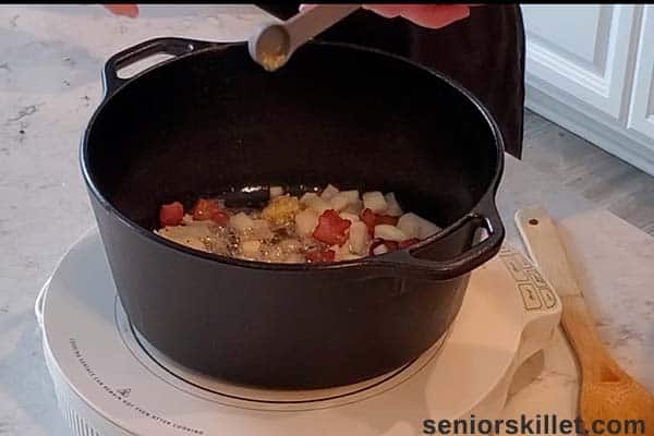 Adding garlic to pan