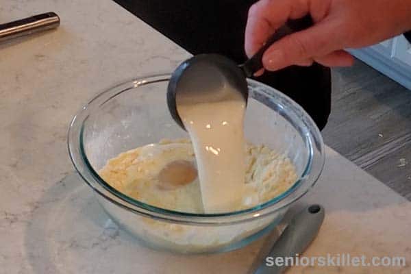 Adding milk to bowl