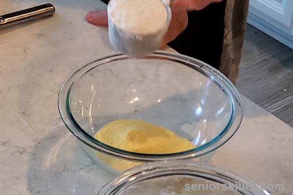 Adding flour to bowl