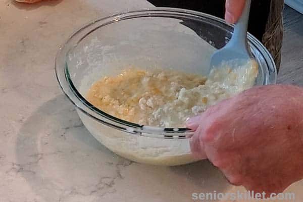 Egg added and mixing batter