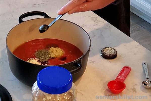 Adding spices to sauce