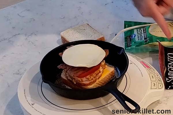 More cheese added to turkey sandwich melt