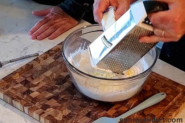 Grating the butter into the bowl