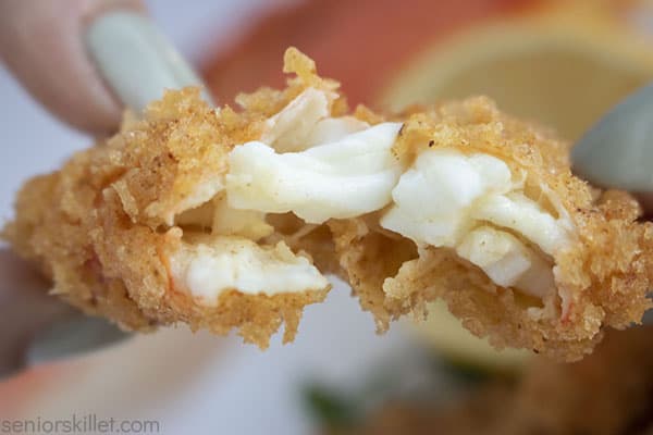 Crispy crab legs opened to show inside