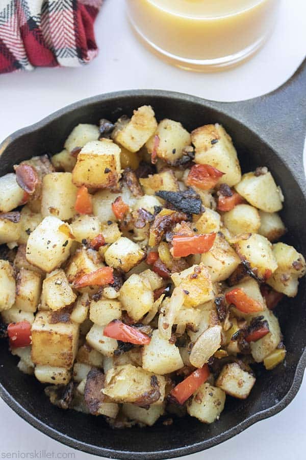 Cooked home fries in a skillet